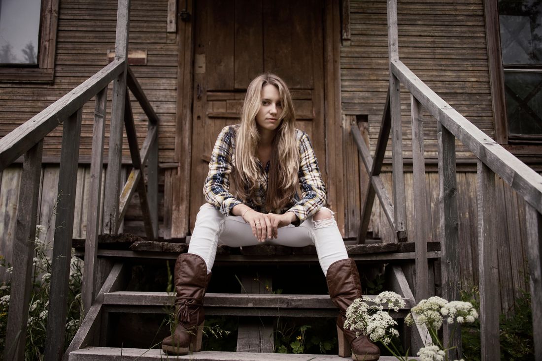 Plaid shirt western look on a rustic wooden porch